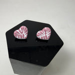 Heart-shaped pink and white patterned earrings 