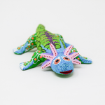 A colorful hand-painted Mexican folk art Axolotl figurine.