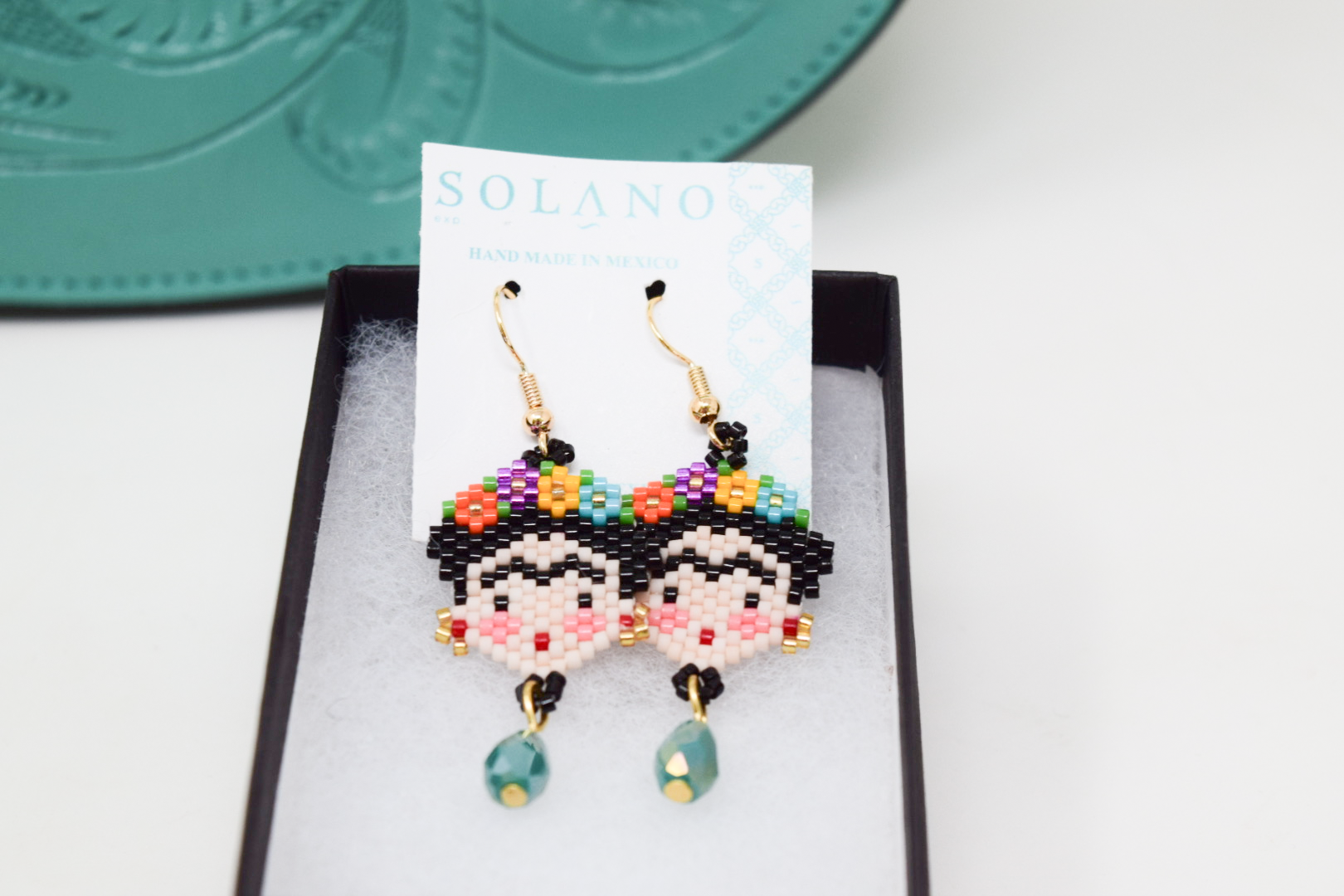 Hand-beaded Frida Kahlo earrings with colorful seed beads and turquoise drops