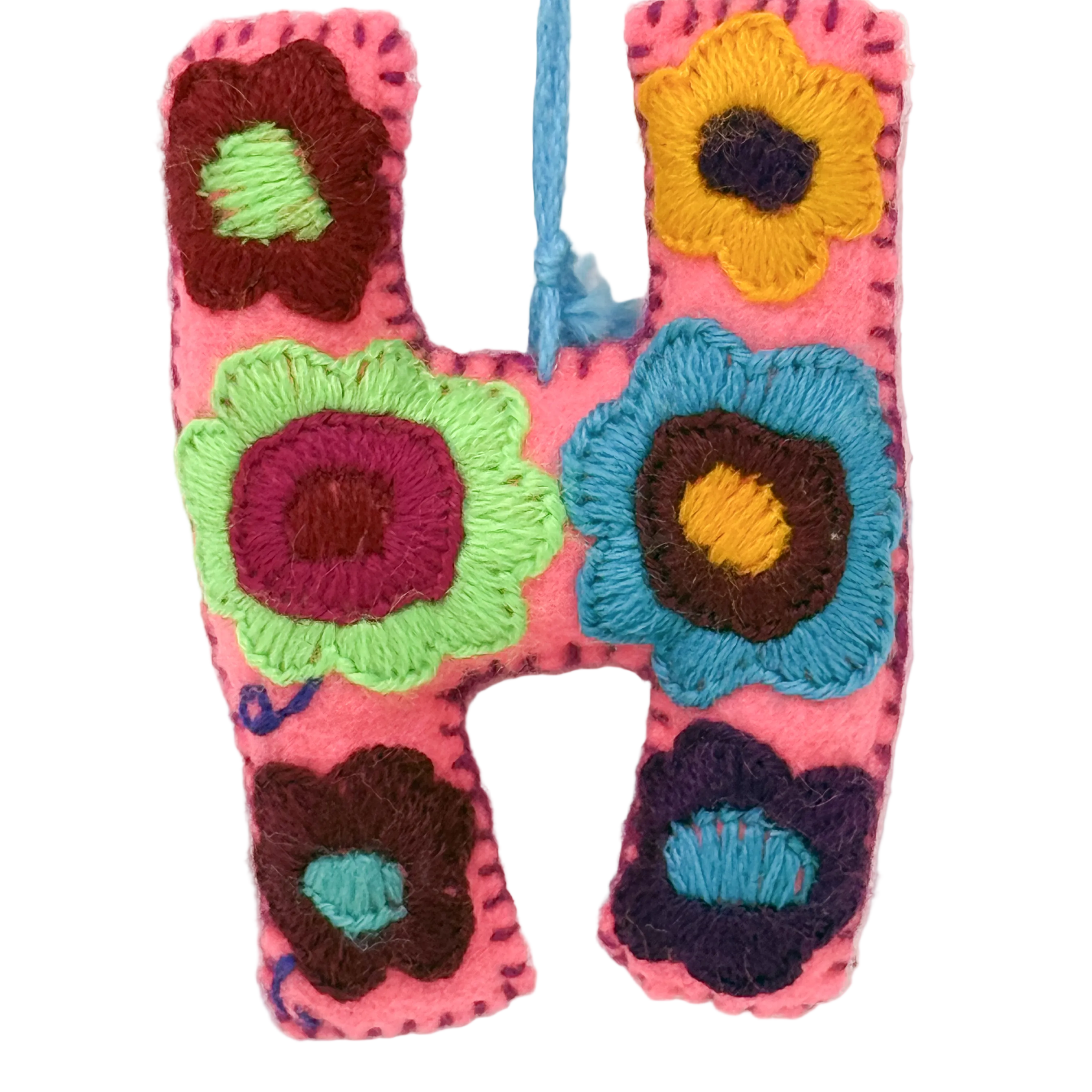 A handmade embroidered letter 'H' ornament from Mexico