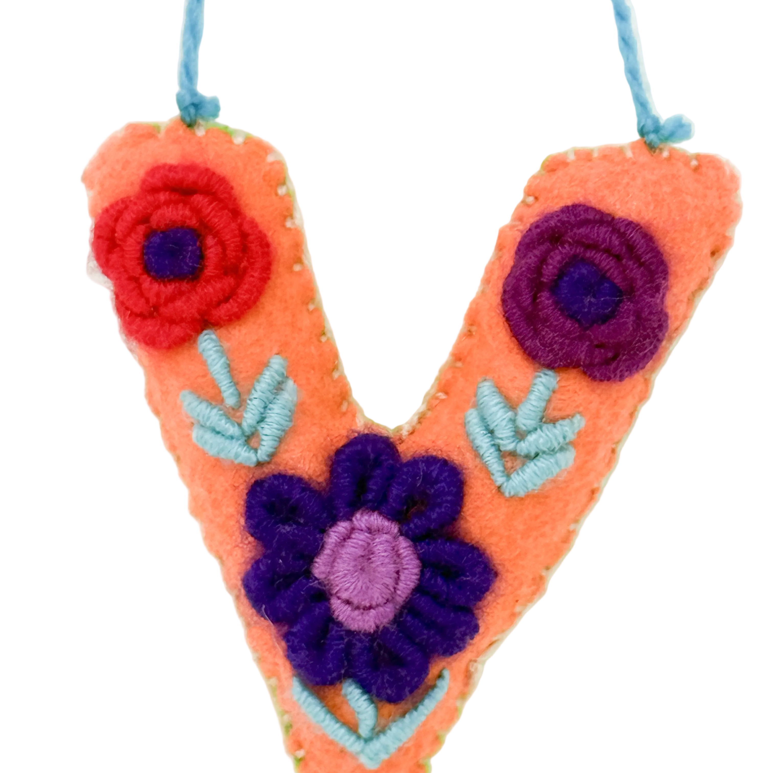A handmade orange felt letter 'V' ornament 