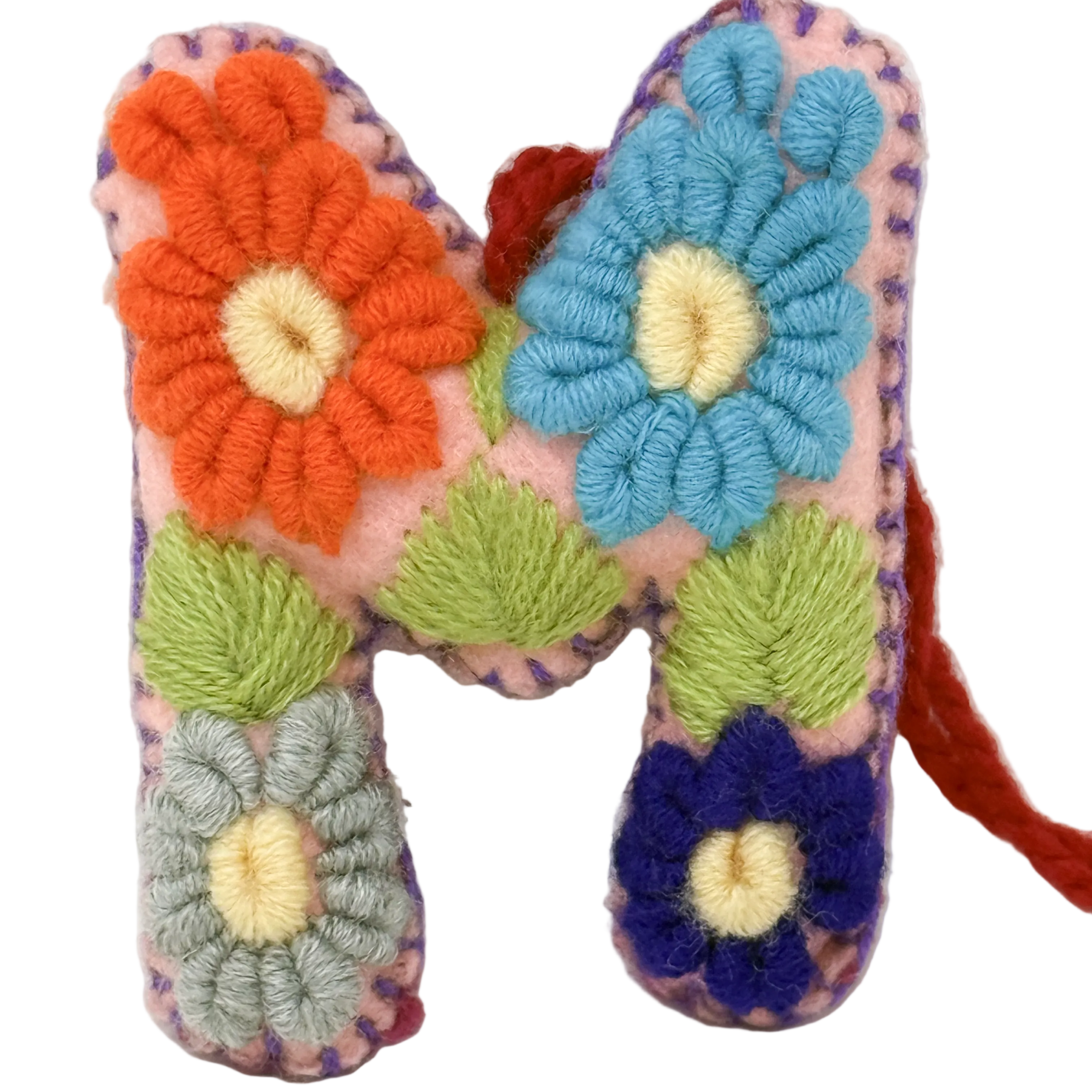 A handmade embroidered letter 'M' 