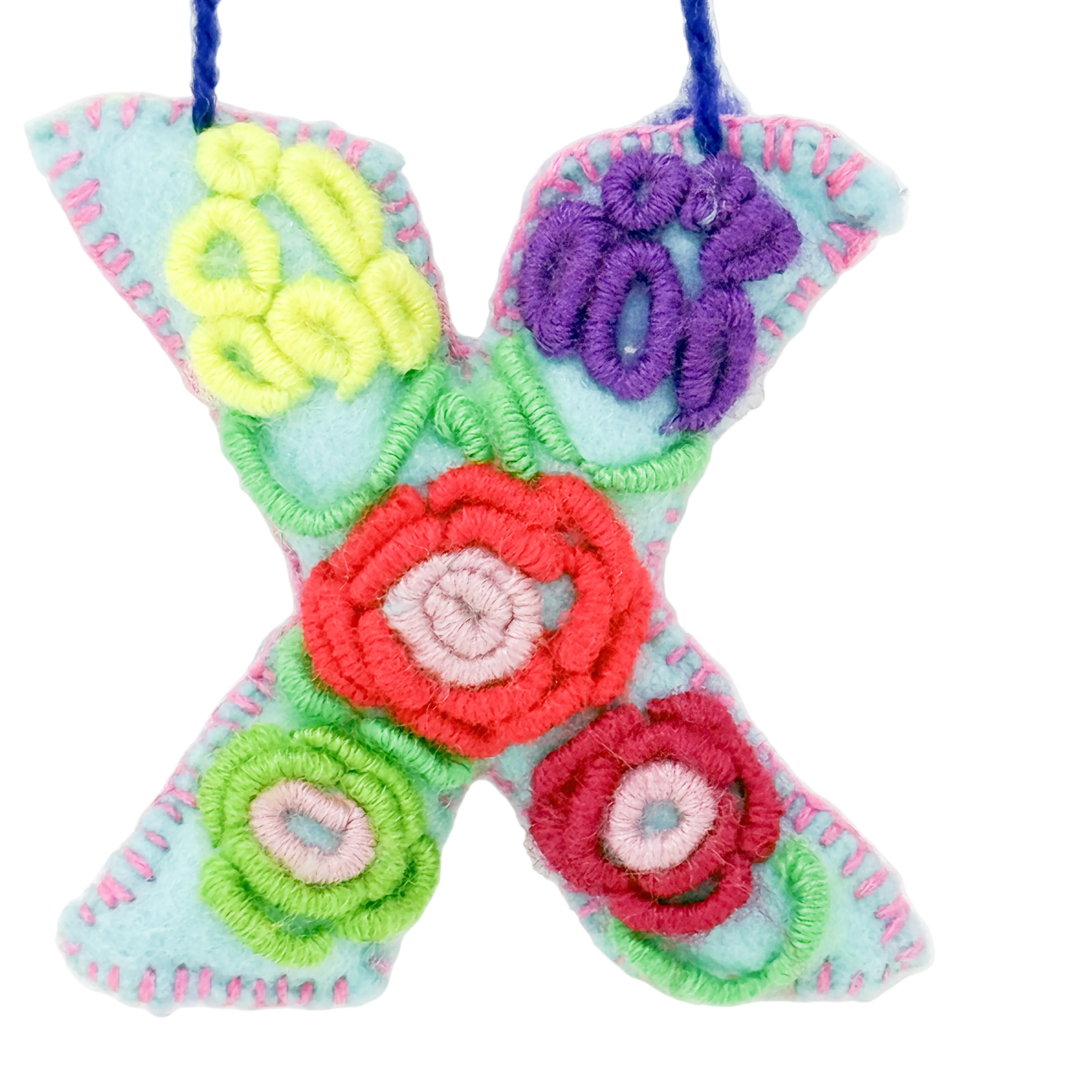 A colorful handcrafted felt ornament letter 'X'